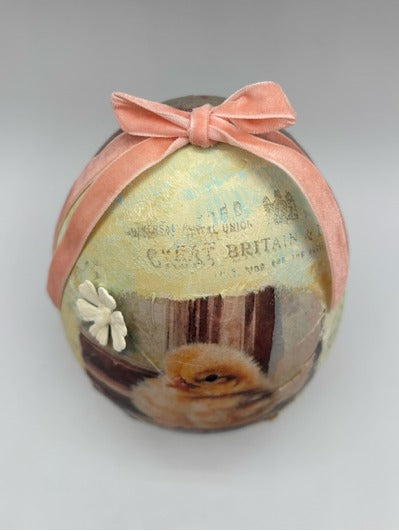 Decorative Easter egg with a chick design 