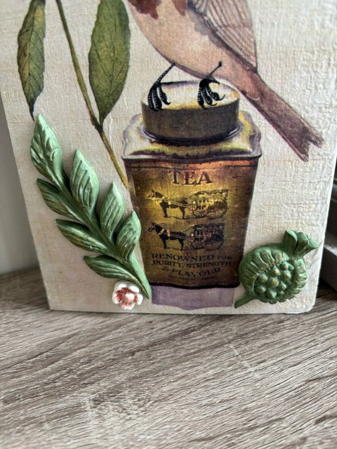 Decorative wood panel with a bird and floral design 
