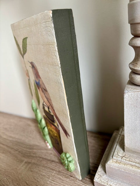 Decorative wood panel with a bird and floral design 