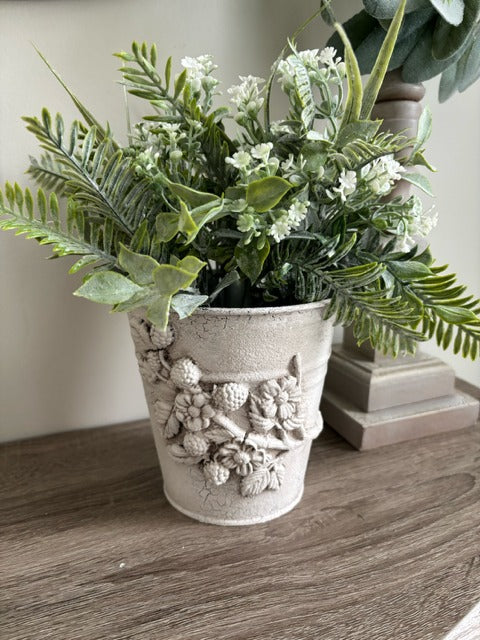 Metal pot with clay berry design and faux greenery