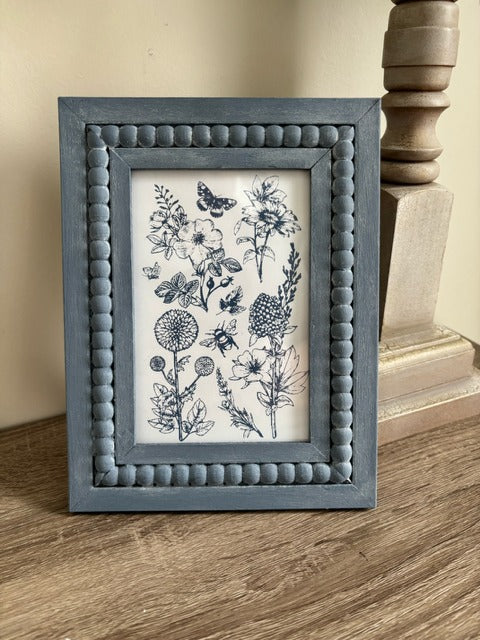 Beaded frame with blue stamped floral print