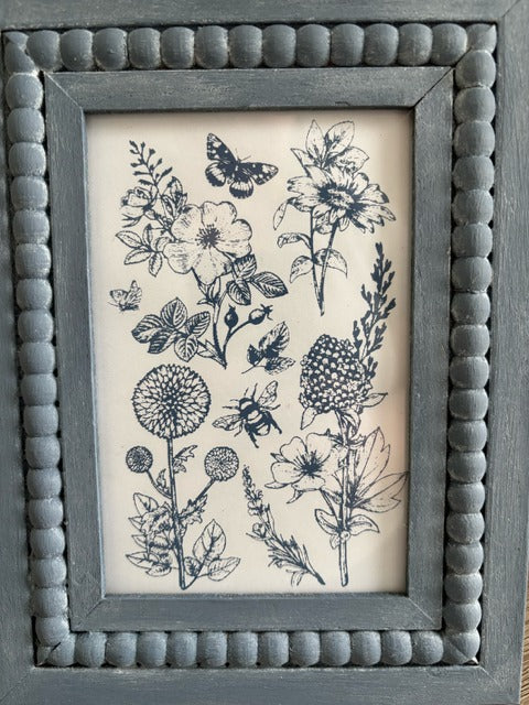 Beaded frame with blue stamped floral print
