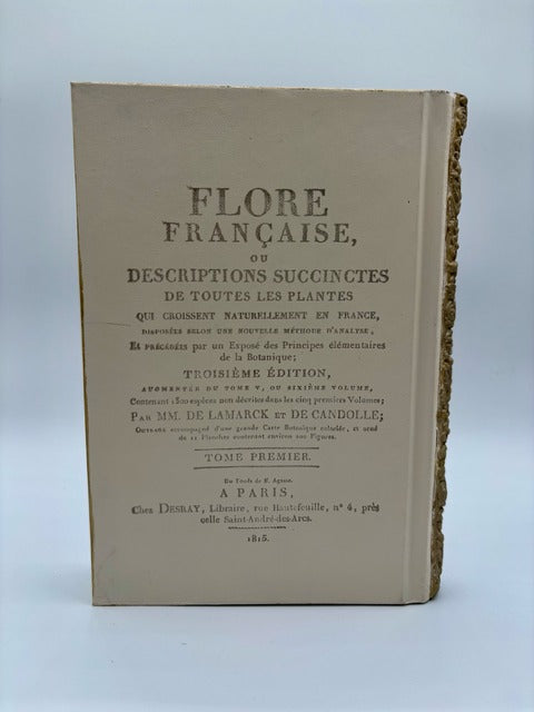 Vintage book titled 'Flore Française' on a light gray background