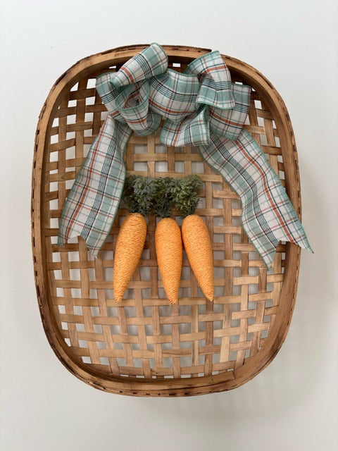Decorative basket with plaid ribbon and carrot-shaped ornaments 