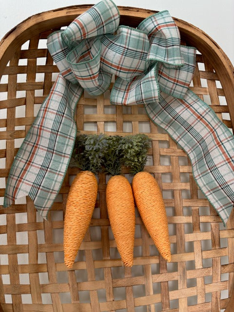 Decorative basket with plaid ribbon and carrot-shaped ornaments 