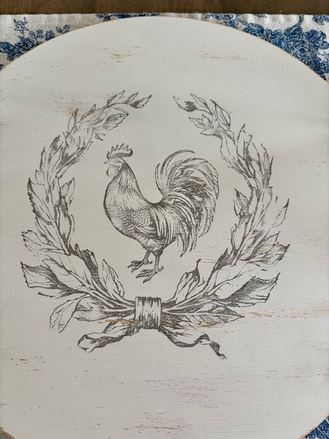 Decorative round tray with a rooster illustration on a white background