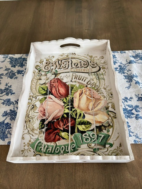 Decorative tray with floral design and text 