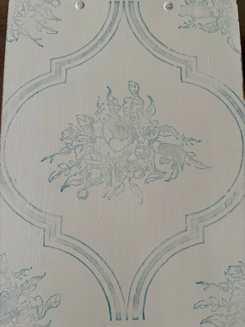 Decorative clipboard with floral design and geometric patterns