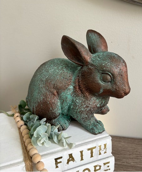 Bunny figurine painted in bronze paint with green patina