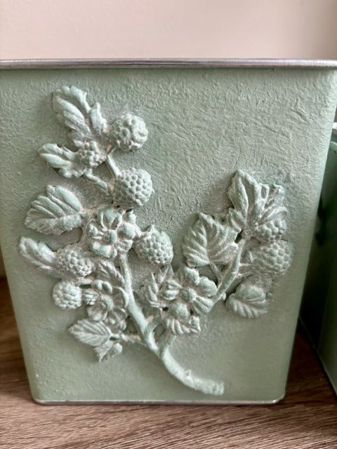 Decorative planter with clay floral design 