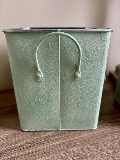 Decorative planter with clay floral design 