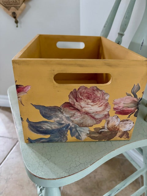 Yellow wooden crate with floral design 