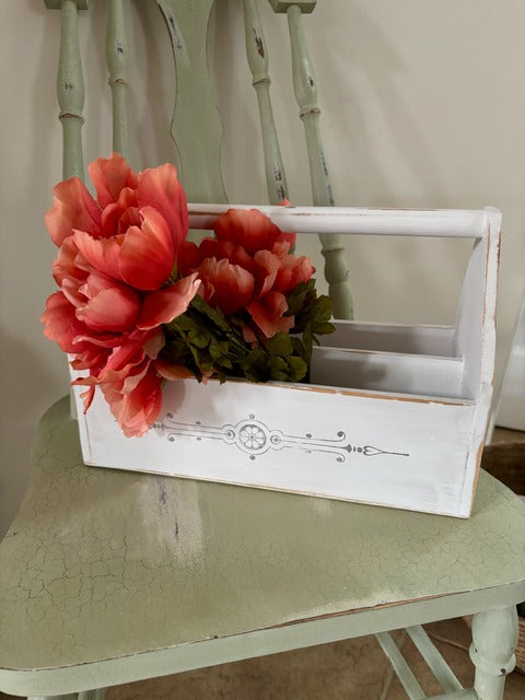 White wooden toolbox with red flowers 