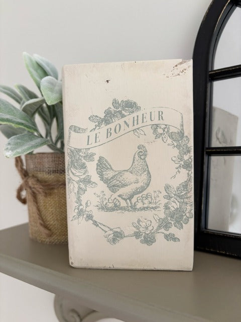 Vintage hen image on a wood block.