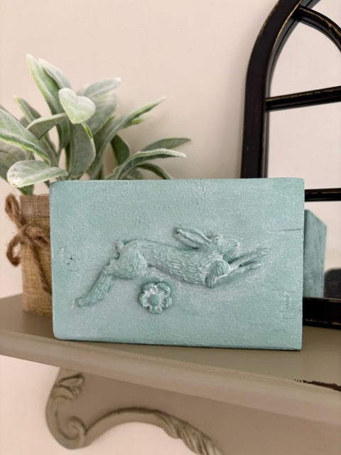 Wood block with clay rabbit