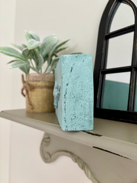 Wood block with clay rabbit