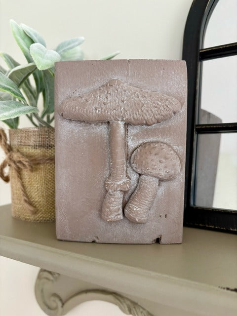 Wood block with clay mushrooms
