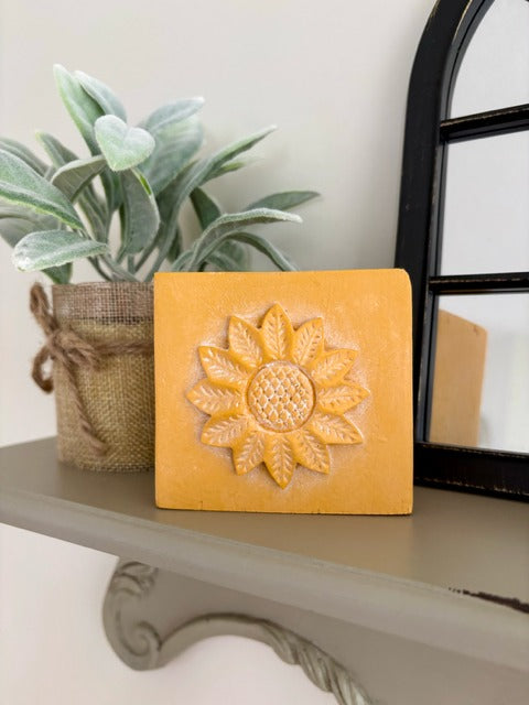 Wood block with clay sunflower