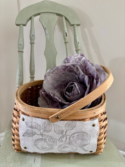Wicker basket with purple flowers 